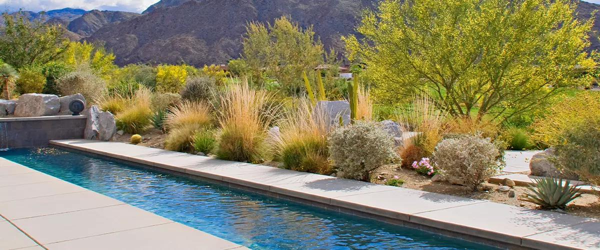 View of mountains from patio of luxury manor house with small pool